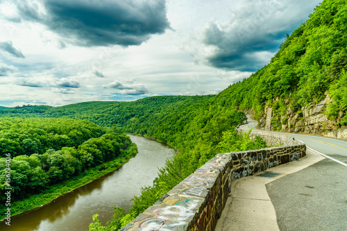 Upper Delaware river bends through a green forest, New York photo
