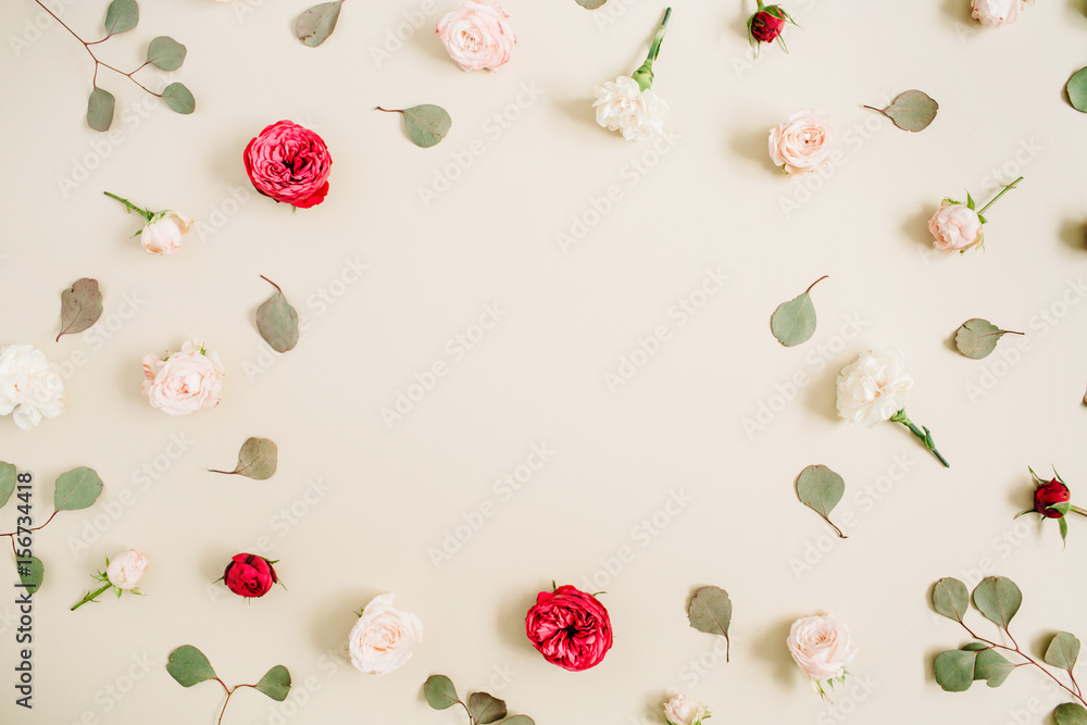Flowers frame made of beige and red roses, eucalyptus leaf on pale pastel beige background. Flat lay, top view. Floral wreath frame background. Flowers frame made of beige and red roses, eucalyptus leaf on pale pastel beige background. Flat lay, top view. Floral wreath frame background.