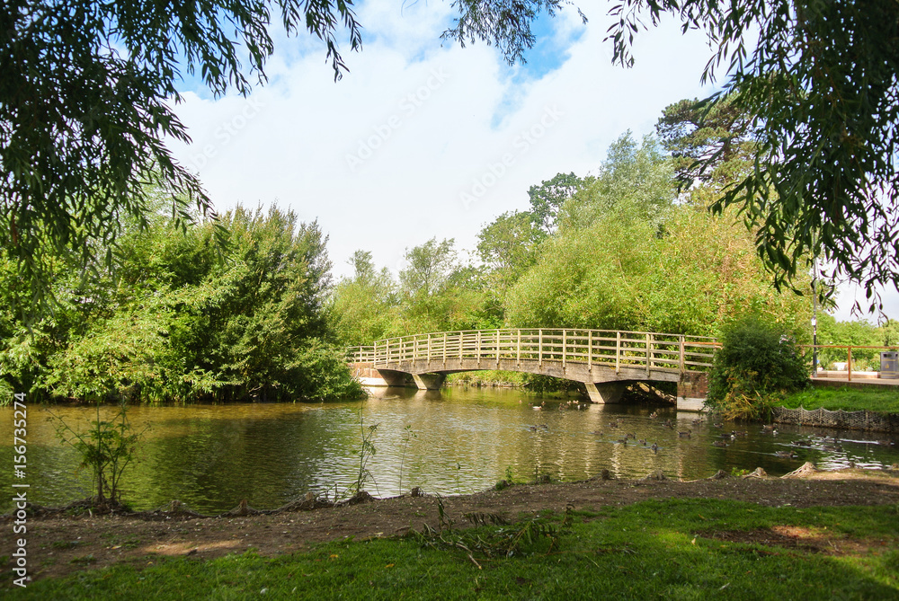 A bridge over a river at the park of Salisbury, England, UK. A bridge over a river at the park of Salisbury, England, UK.