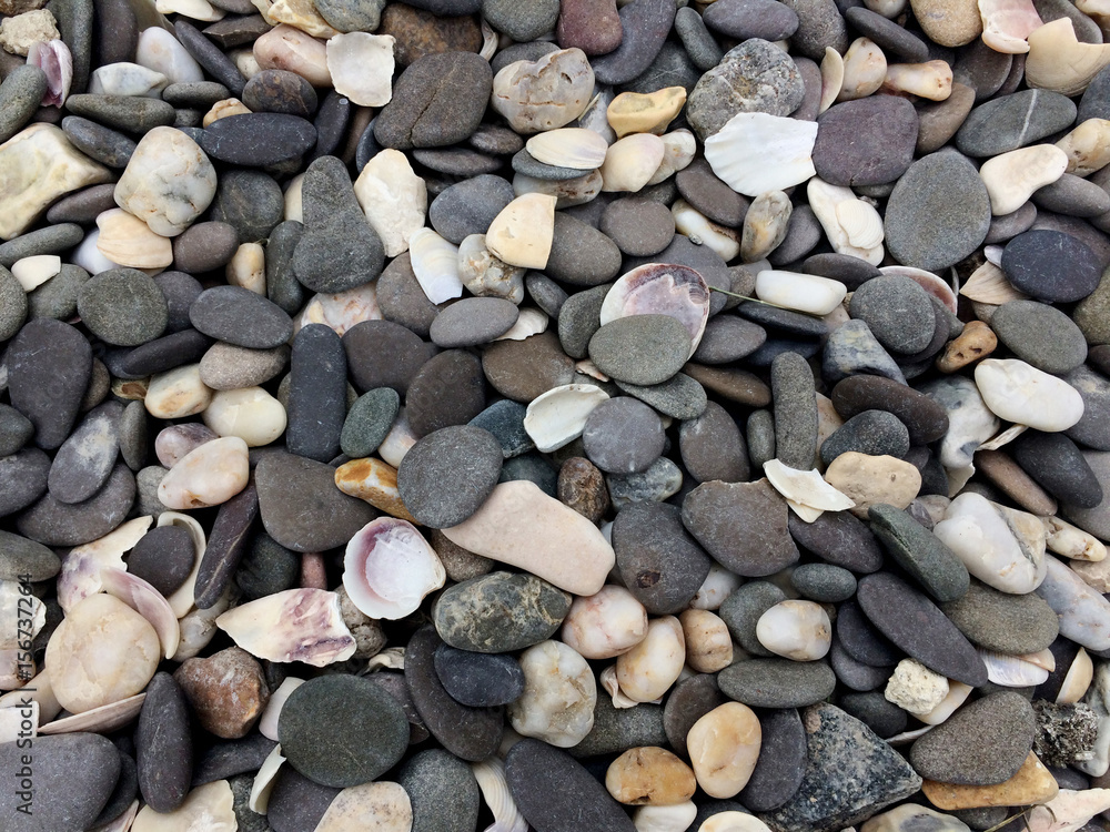 Naklejka premium texture, stone, rock, material, pebble, pattern, mineral, nature, ground, shape, decoration, background, smooth, wallpaper, outdoor, geology, natural, textured, sand, cobblestone, river, pile, small, 