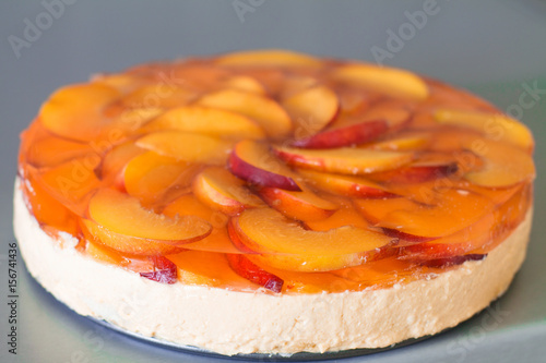Wallpaper Mural Fruit cake with peach, jelly and mousse in plate on gray background. Torontodigital.ca