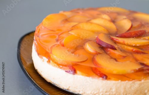Wallpaper Mural Fruit cake with peach, jelly and mousse in plate on gray background. Torontodigital.ca