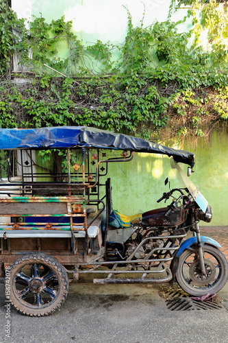 Old tuk-tuk parked on a street of downtown Vientiane-Laos. 4786 photo