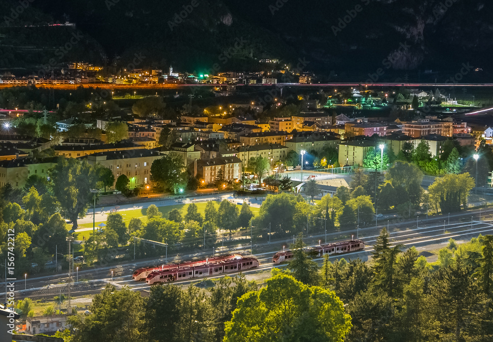 Day to night transition, energy management concept, skyline of Trento, Italy