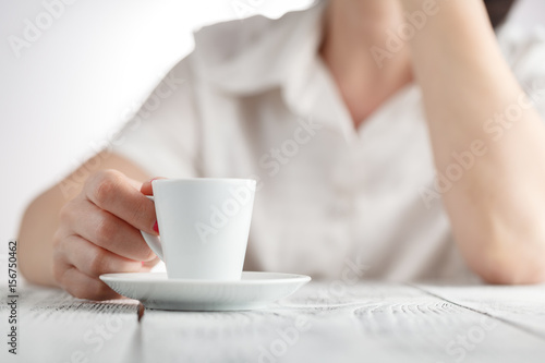 Female hands and cup of coffee
