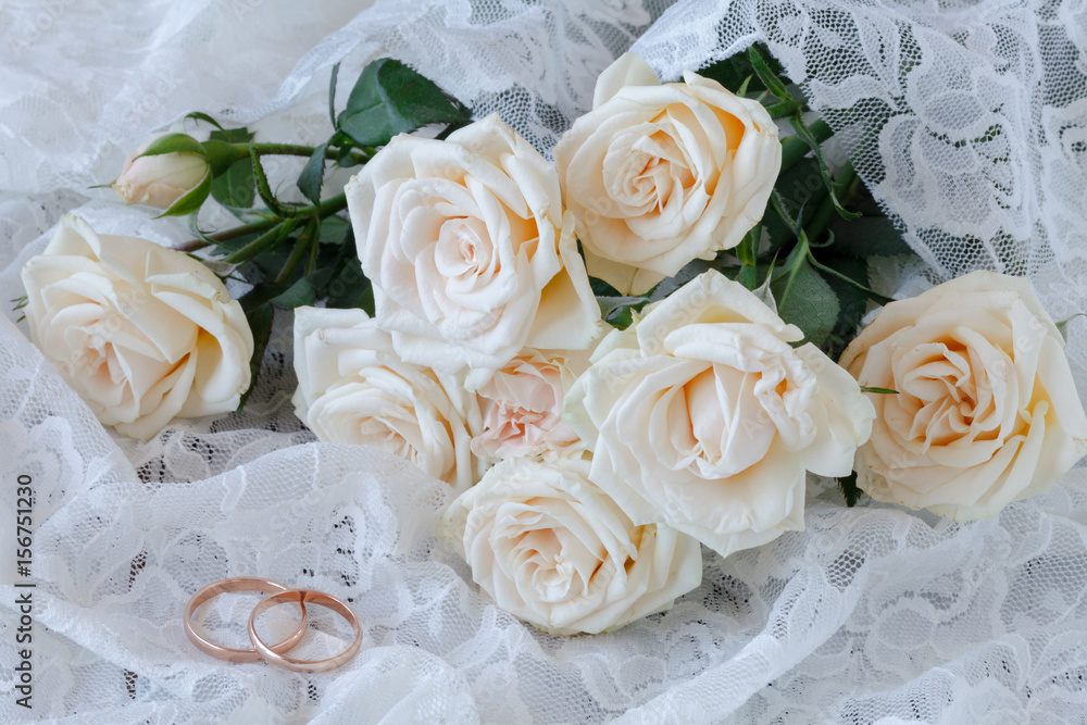The rings on the flowers on a white fabric, wedding details The rings on the flowers on a white fabric, wedding details