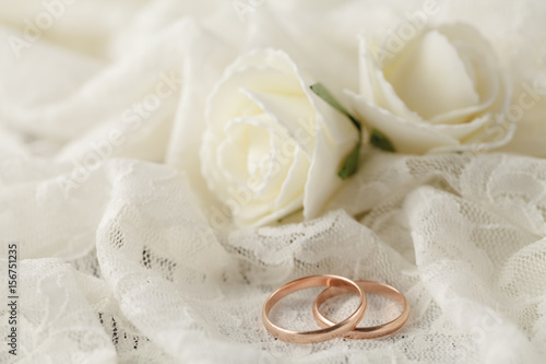 The rings on the flowers on a white fabric, wedding details