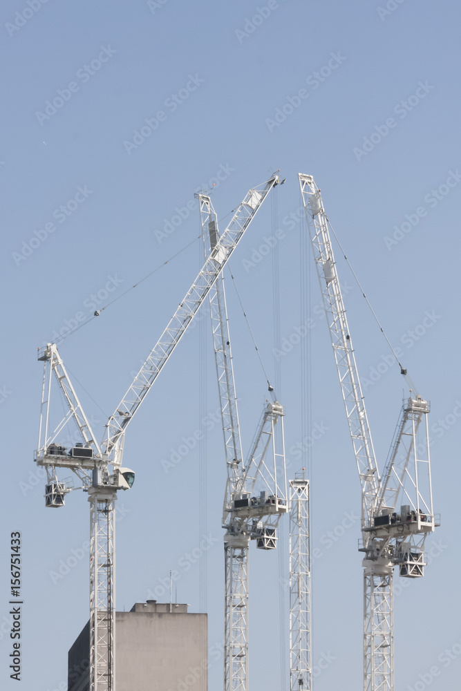 Cranes in construction site for new apartments