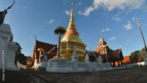 timelapse of Wat Pong Sanuk Lampang with blue sky in, Northern Thailand. photo