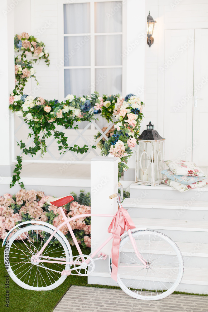 White Bicycle near beautiful Flowers on vintage background in spring season
