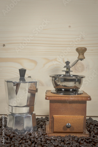 Coffee grinder on wood background