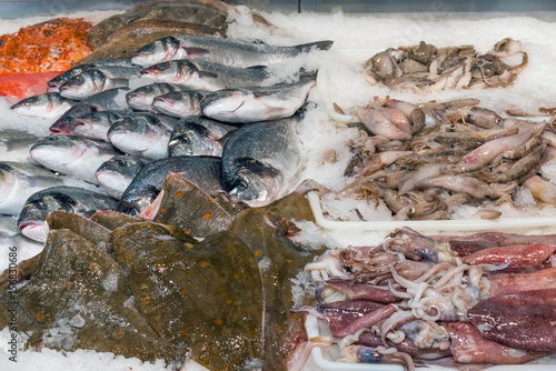 Fish and squid for sale at a market photo