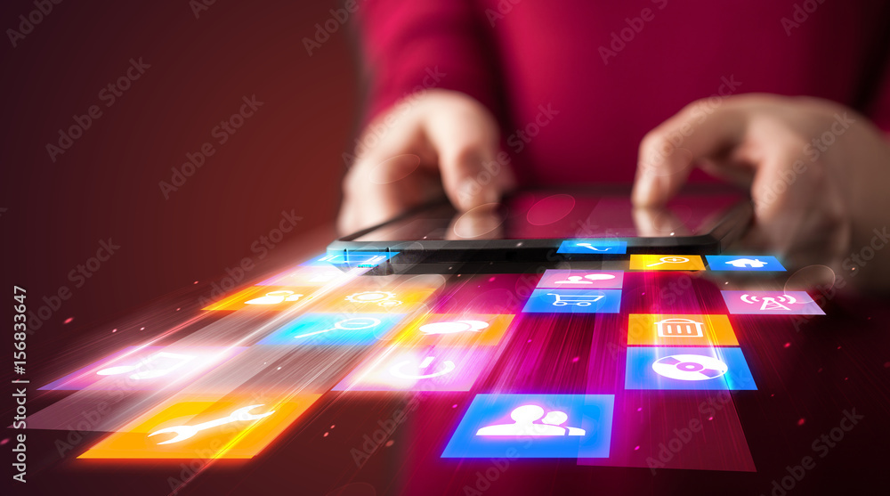 Fototapeta premium Hand holding tablet device with media application