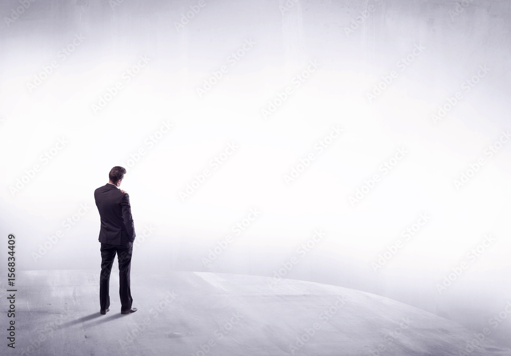 Business person standing from rear view Business person standing from rear view