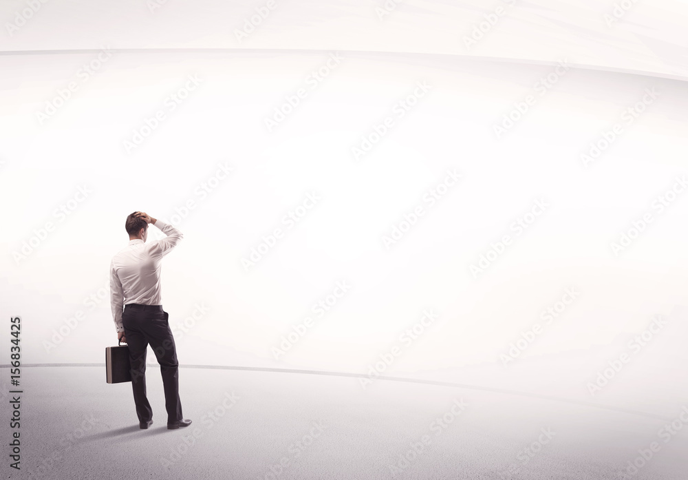 Businessman with briefcase standing still Businessman with briefcase standing still