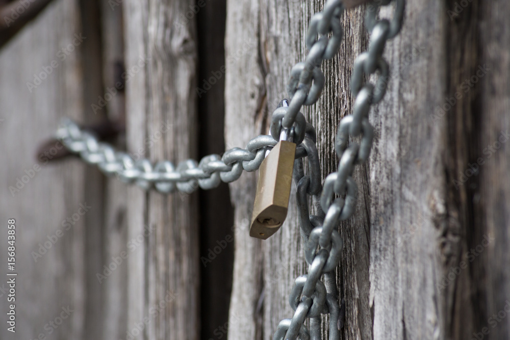 chain lock on wooden wall chain lock on wooden wall