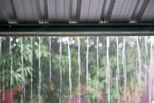rain drops fast dipping from zinc roof