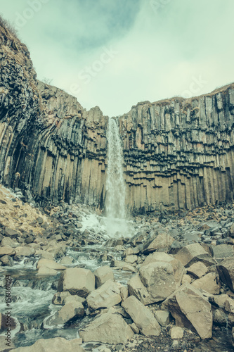 Beautiful famous waterfall in Iceland, winter season . ( Filtered image processed vintage effect. )