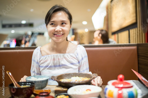 Asian woman select menu for order © hin255