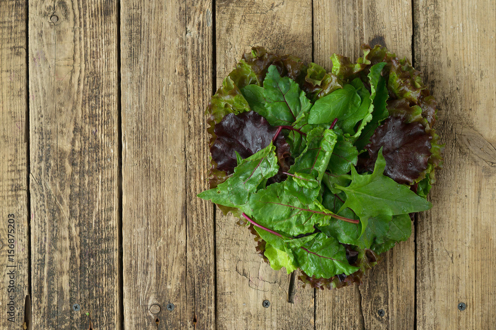 Healthy eating in a healthy heart. Fresh herbs laid out in the shape of a heart. The concept Healthy eating in a healthy heart. Fresh herbs laid out in the shape of a heart. The concept