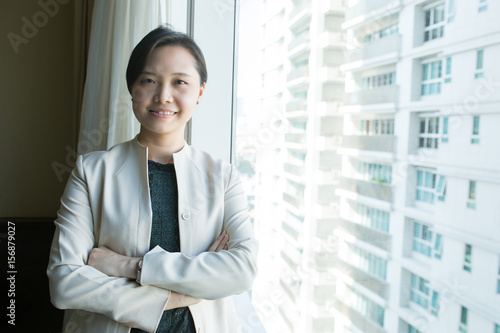 Asian business woman calling in the office room. Free Download Asian business woman calling in the office room. - GFXLoad