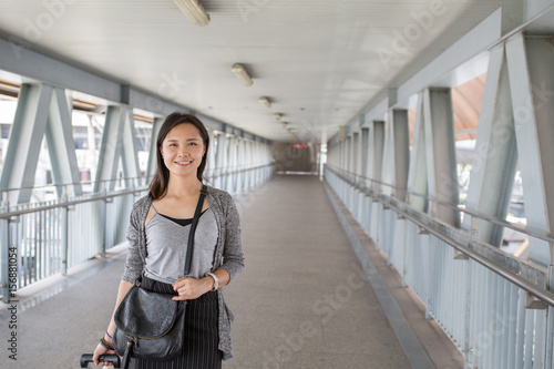 Asian woman traveller walking