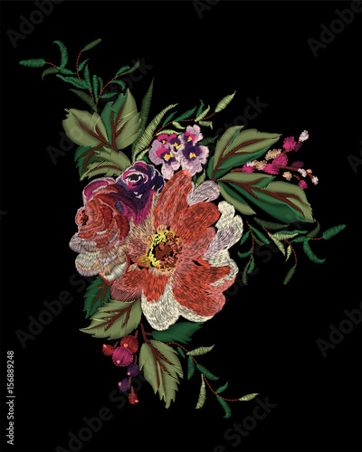 Colorful embroidery on a black background. A beautiful bouquet of roses for the design of clothes.