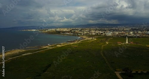 Wallpaper Mural cloud landscape in a resort town. Cottages, sea, vacation, mountains Cyprus. Paphos. moody seascape before the storm.	 Torontodigital.ca