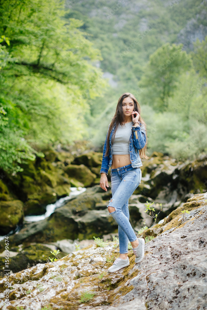 long hair woman posing in mountains long hair woman posing in mountains