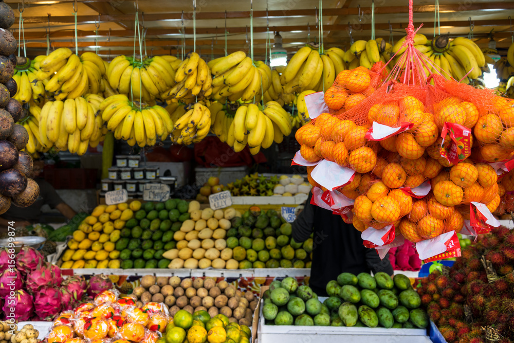 Fruit stall with bananas of different types and other fruits at Chow Kit market, Malaysia.