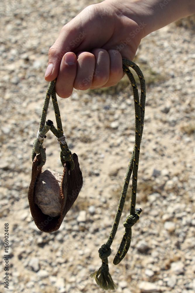 Ancient weapon - Sling for stone throwing. Stock Photo | Adobe Stock