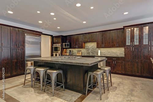 Modern open floor kitchen design in grey tones