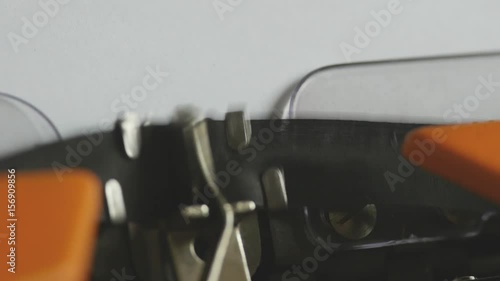 Close up footage of a person writing PROLOGUE on an old typewriter, with sound...