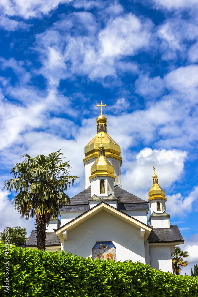 Ukrainian Church of the Virgin Dormition against the blue sky. France, Lourdes
