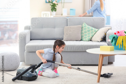 Mother and daughter cleanin...