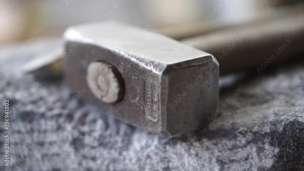Closeup of Hammer and Chisel on a Stone Closeup of Hammer and Chisel on a Stone