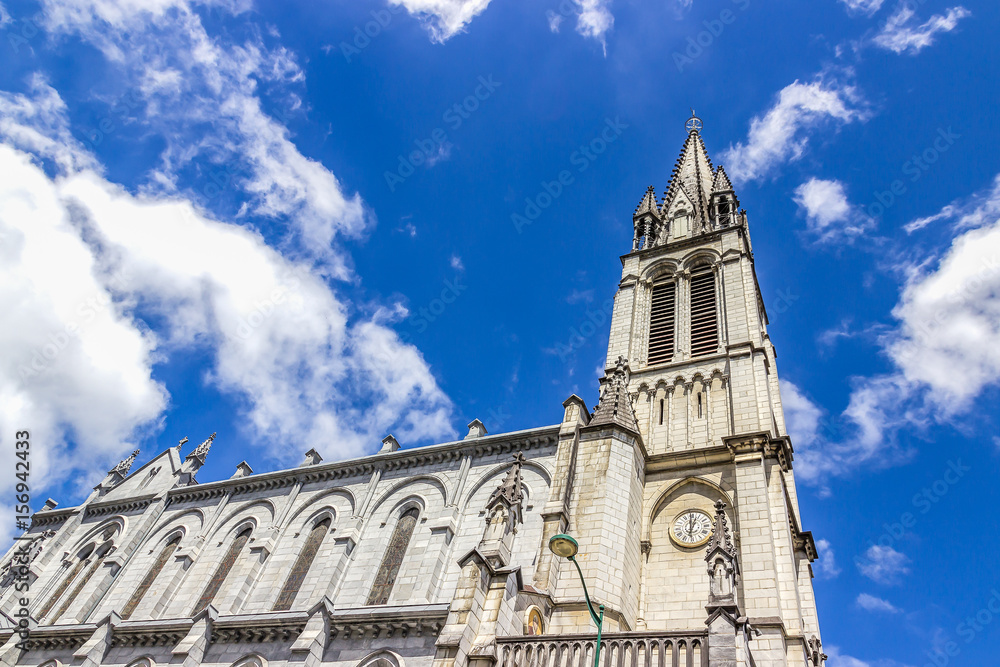 Sanctuary of Our Lady of Lourdes against blue sky. France