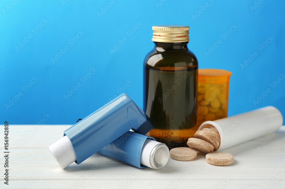 Asthma inhalers with medicines on blue background StockFoto Adobe Stock