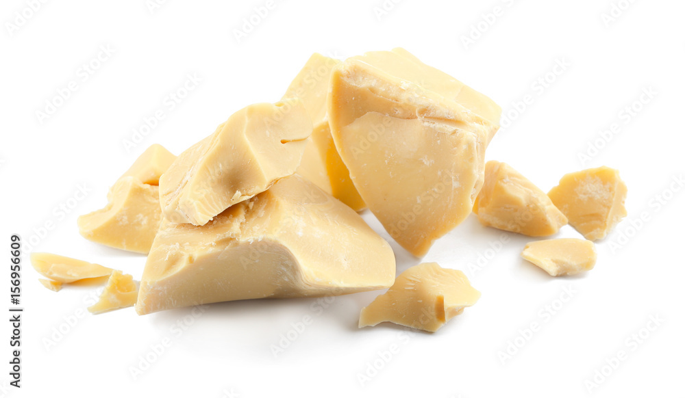 Pieces of cocoa butter on white background