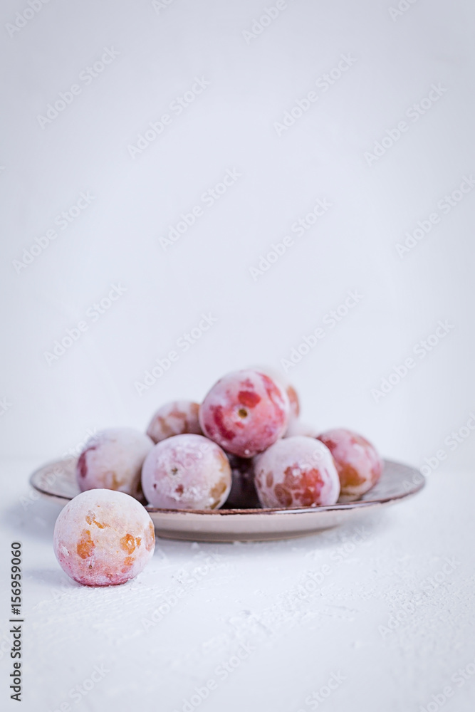 Frozen Plums as Ingredient for Smoothie or Cake Desert Fresh Fruit Isolated Copy Space