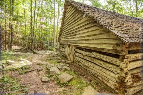 Pioneer Log Cabin. Log cabin in a lush mountain valley in the Great Smoky Mountains National Park. This cabin is a historical display in a national park not a privately owned property or residence.