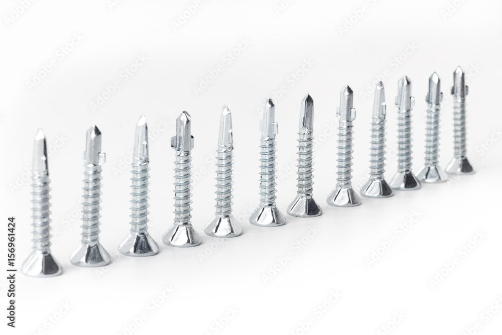 Driller dowel and screw isolated on white background Driller dowel and screw isolated on white background