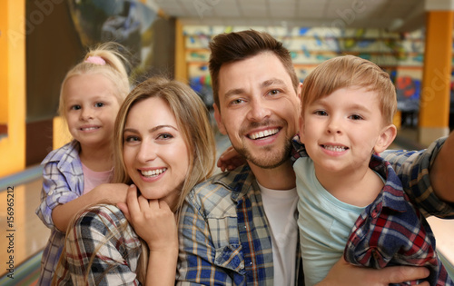 Family taking selfie at bowling club