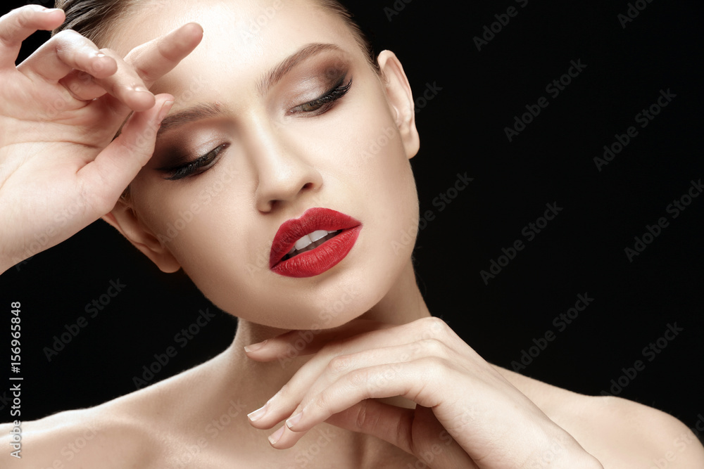 Beautiful young woman on dark background, closeup Beautiful young woman on dark background, closeup