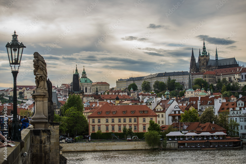 Obraz premium Colorful Prague gothic Castle above the River Vltava with Charles Bridge after Sunset, Czech Republic