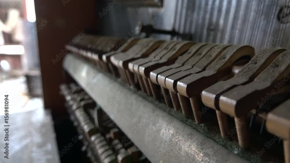 Musical Instruments Bumpy CLOSE UP, DOF: Old crumbling dusty piano from the inside. Hammers ...