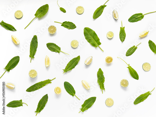 Pattern of citrus. Sorrel, slices of lemon and lime isolated on white background. Abstract food background.
