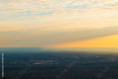 Aerial view of forest and settlements from the top of the Stone Mountain at sunset, Georgia, USA