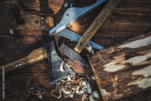 Old carpentry tools on the wooden board
