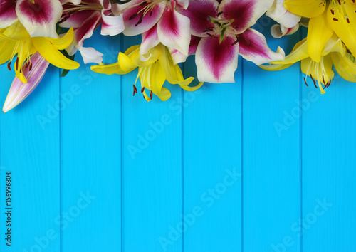 Fototapeta Naklejka Na Ścianę i Meble -   lily flowers on wooden planks